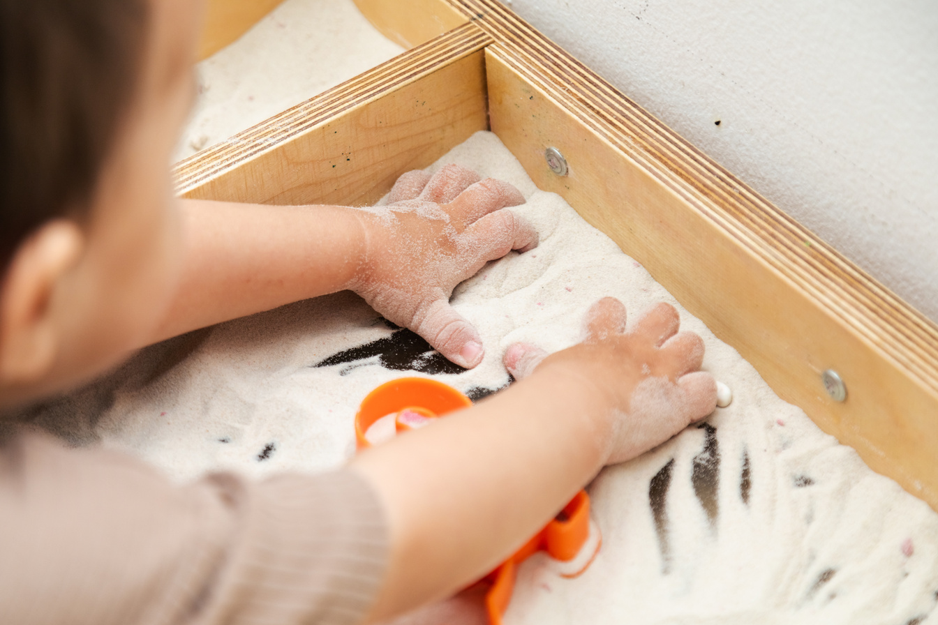 Closeup of Toddler Playing Kinetic Sand