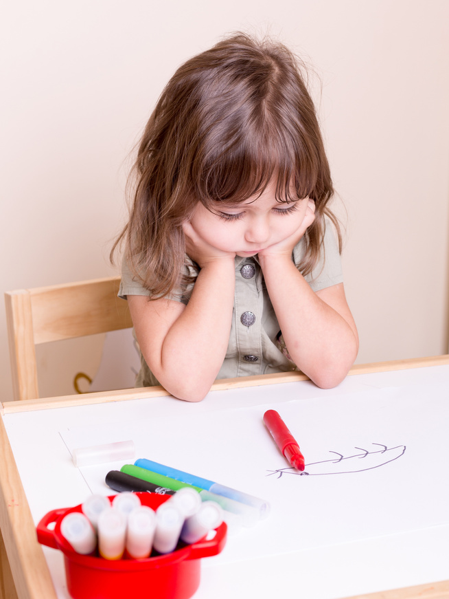 upset bored kid at school